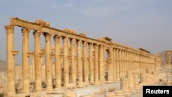 FILE - Ancient monuments like this colonnade in the historical city of Palmyra, Syria, were targeted by the Islamic State group and among cultural sites destroyed in 2015.