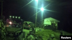 An undated handout photograph released by Kenya's Ministry of Defense on September 29, 2012, shows members of the Kenyan Defense Forces during an operation at an undisclosed location in Somalia.