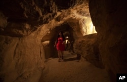 FILE - A tourist visits the inside of the Great Pyramid, built by Cheops, known locally as Khufu in Giza, Egypt, June 2, 2016.