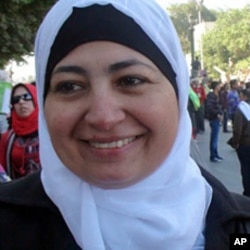 Salwa, a mother of four, celebrates on Tahrir Square one week after a popular uprising ushers in a new era in Egyptian politics, February 18, 2011