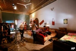 Iraqi actors perform their roles in "The Hotel," at a filming location in Baghdad, April 26, 2019.