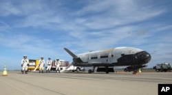 his undated photo provided by the U.S. Air Force shows an X-37B Orbital Test Vehicle at NASA's Kennedy Space Center in Florida. An unmanned Falcon rocket that carried one of these experimental planes blasted off Thursday, Sept. 7, 2017.