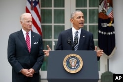 President Obama, with Vice President Biden, promises a smooth transition.
