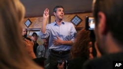 FILE - Former Texas congressman Beto O'Rourke addresses a gathering during a campaign stop at a restaurant in Manchester, New Hampshire, March 21, 2019.