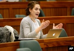 FILE - Shannon Erwin, executive director of the Muslim Justice League, addresses an audience during a meeting titled "Resilience to Violent Extremism: Effective Intervention Approaches," at Suffolk Law School in Boston, Nov. 10, 2015. The meeting examined the initiative called Countering Violent Extremism in Los Angeles, Minneapolis, and Boston.