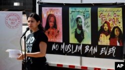 Avideh Moussavian, Senior Policy Attorney, National Immigration Law Center, speaks during a media availability for a video installation to protest President Donald Trump's ban on Muslims, April 23, 2018, at Union Station in Washington.