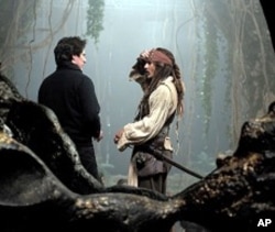 Director Rob Marshall on the set of the movie with Johnny Depp