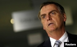 FILE - Brazil's President-elect Jair Bolsonaro arrives for a meeting in Brasilia, Brazil, Nov. 20, 2018.