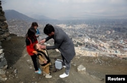 FILE - A boy receives polio vaccination drops during an anti-polio campaign in Kabul, Afghanistan, March 14, 2018.