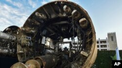Tunnel boring equipment is displayed before an unveiling event for the Boring Company Hawthorne test tunnel in Hawthorne, Calif., on Tuesday, Dec. 18, 2018. (Robyn Beck/Pool Photo via AP)