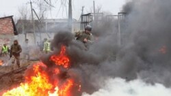 Reservists of the Ukrainian Territorial Defense Forces take part in military exercises at a training ground outside Kharkiv, Ukraine Dec. 11, 2021.