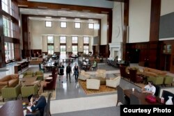 Students pass through one of the buildings on campus at Elon University in Elon, North Carolina.