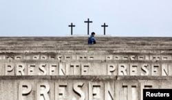 People walk at the Redipuglia Military Sacrarium, Italy, Sept. 12, 2014.