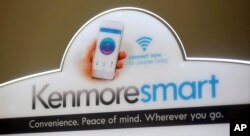 A Kenmore Elite Smart sign rests on top of the Kenmore Elite Smart French Door Refrigerator at a Sears store, July 20, 2017, in West Jordan, Utah.