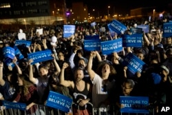 Supporters cheer during a campaign rally for Democratic presidential candidate Bernie Sanders, I-Vt., at Hunters Point park, April 18, 2016.
