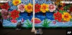 Mardi Gras master float painter Raymond J. Bowie paints a float at Kern Studios in New Orleans, Jan. 16, 2016. Bowie has been painting Mardi Gras floats for nearly forty years.