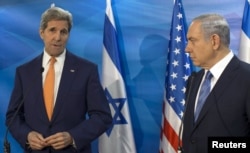 FILE - Israeli Prime Minister Benjamin Netanyahu (R) and John Kerry brief the media before their meeting at Prime Minister's Office in Jerusalem, Nov. 24, 2015.
