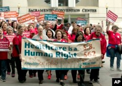 Supporters of single-payer health care march to the Capitol in Sacramento, Calif., April 26, 2017.