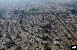 Homes burned by a wildfire are seen, Oct. 11, 2017, in Santa Rosa, Calif.