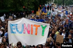 People hold banners during a "March for Europe" demonstration against Britain's decision to leave the European Union, in central London, Britain, July 2, 2016. Britain voted to leave the European Union in the EU Brexit referendum.