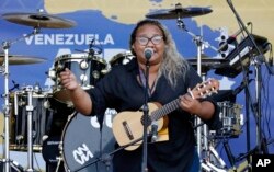 Reymar Perdomo sings "I Left," during the Venezuela Aid Live concert on the Colombian side of the Tienditas International Bridge near Cucuta, Colombia, on the border with Venezuela, Feb. 22, 2019.
