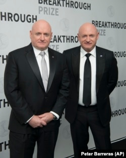 Astronauts Scott Kelly, left, and Mark Kelly backstage at the fIfth annual Breakthrough Prize Ceremony on Sunday, Dec. 4, 2016 at the NASA Ames Research Center in Mountain View, Calif.