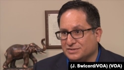 Republican Larry Gonzales, who serves in the Texas House of Representatives, defends the redistricting effort led by his party. (J. Swicord/VOA).