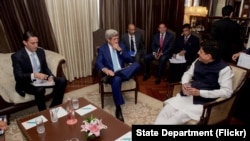 U.S. Secretary of State John Kerry, flanked by State Department Special Envoy and Coordinator for International Energy Affairs Amos Hochstein, sits with Indian Minister of Power Piyush Goyal on August 30, 2016, at the Le Meridien Hotel, in New Delhi, Indi