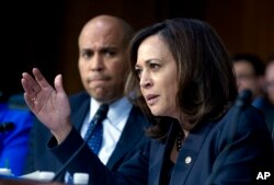 Sen. Kamala Harris D-Calif., accompanied by Sen. Cory Booker D-N.J., questions Homeland Security Secretary Kirstjen Nielsen during a hearing, Jan. 16, 2018, in Washington.