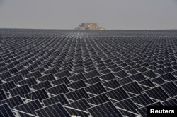 FILE - Solar panels are seen in Yinchuan, Ningxia Hui Autonomous Region, China, April 18, 2017.