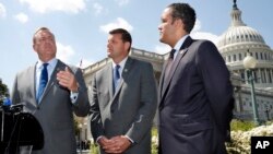 Rep. Jeff Denham, R-Calif., left, speaks next to Rep. David Valadao, R-Calif., and Rep. Will Hurd, R-Texas, during a news conference with House Republicans who are collecting signatures on a petition to force House votes on immigration legislation, May 9, 2018.