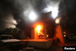 The U.S. Consulate in Benghazi is seen in flames during a protest by an armed group said to have been protesting a film being produced in the United States September 11, 2012.