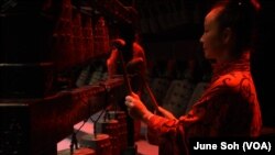 A musician of the Henan Museum's orchestra plays a bianzhong.