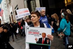 Protesters, organized by The Brady Campaign to Prevent Gun Violence, stage a "die-in" in front of Trump Tower, the residence of Republican presidential candidate Donald Trump, March 16, 2016, in New York.