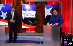 FILE - Rep. Jacky Rosen, D-Nev., right, prepares before a U.S. Senate debate with Sen. Dean Heller, R-Nev., Oct. 19, 2018, in Las Vegas.