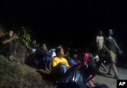 Residents wait as they evacuate to higher ground following an earthquake in Lombok, Indonesia, Aug. 5, 2018.