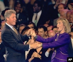 Bill Clinton and Hillary Rodham Clinton dance on stage during a "Get-Out-The-Vote" rally at the Brendan Byrne Arena in East Rutherford, N.J. Sunday night, Nov. 1, 1992. (AP Photo/Susan Ragan, File)