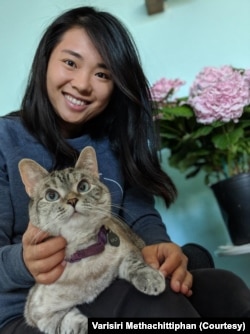 Nala, the most famous cat on the internet, and her Thai owner, Varisiri Methachittiphan.