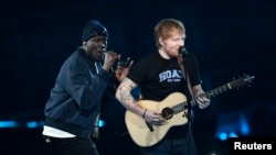 Ed Sheeran and Stormzy perform at the Brit Awards at the O2 Arena in London, Feb. 22, 2017.