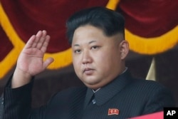 FILE - North Korean leader Kim Jong Un gestures as he watches a military parade in Pyongyang, North Korea.