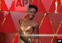 FILE - Lupita Nyong'o arrives at the Oscars at the Dolby Theatre in Los Angeles, March 4, 2018.