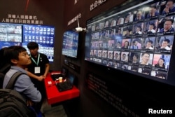 FILE - Facial recognition technology is shown at DeepGlint booth during the China Public Security Expo in Shenzhen, China October 30, 2017. Picture taken October 30, 2017.