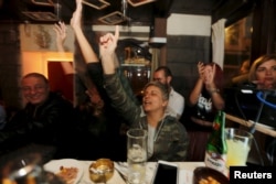 People dance at 80s Bar in Damascus, Syria, March 11, 2016. In Damascus's Old City, just a mile from the battered frontline between government and rebel-held territory, young Syrians smoke, drink beer or soft drinks, and talk about anything but the war.