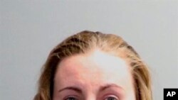 A photo of Oakland County Sheriff's Office shows Jillian Wuestenberg. She and her husband, Eric Wuestenberg, were arrested after at least one handgun was pulled on a Black woman and her daughters during a confrontation in Orion, Mich., July 2, 2020.