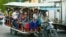 Garment workers wear masks on a shared ride to their homes in Phnom Penh, Cambodia, on March 10, 2021. (Hean Socheata/VOA Khmer) 