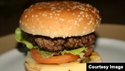 A man appears to have broken into a popular burger restaurant only to make a burger for himself. (Photo by Benedikt Koehler via Flickr)