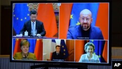 Chinese President Xi Jinping, European Council President Charles Michel, European Commission President Ursula von der Leyen, French President Emmanuel Macron, and German Chancellor Angela Merkel during an EU-China Leaders' video conference in Brussels, Belgium, Dec. 30, 2020.