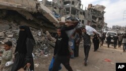 غزې کې تر اوربند وروسته ګڼ شمیر خلک بیرت خپلو کورونو ته ستانه شوي. 