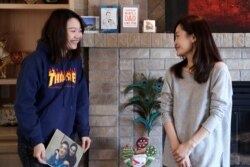 Jodie Chen, right, and her daughter, Mandy Luo, pose for a portrait in their home in Issaquah, Wash., April 13, 2020.
