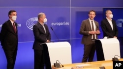 Members of European Parliament, David McAllister, Andreas Schieder, Christophe Hansen and Bernd Lange participate in a media conference after a debate on the EU-UK trade and cooperation agreement at the European Parliament in Brussels, April 27, 2021. 